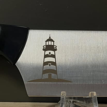 Laser-engraved lighthouse on a knife